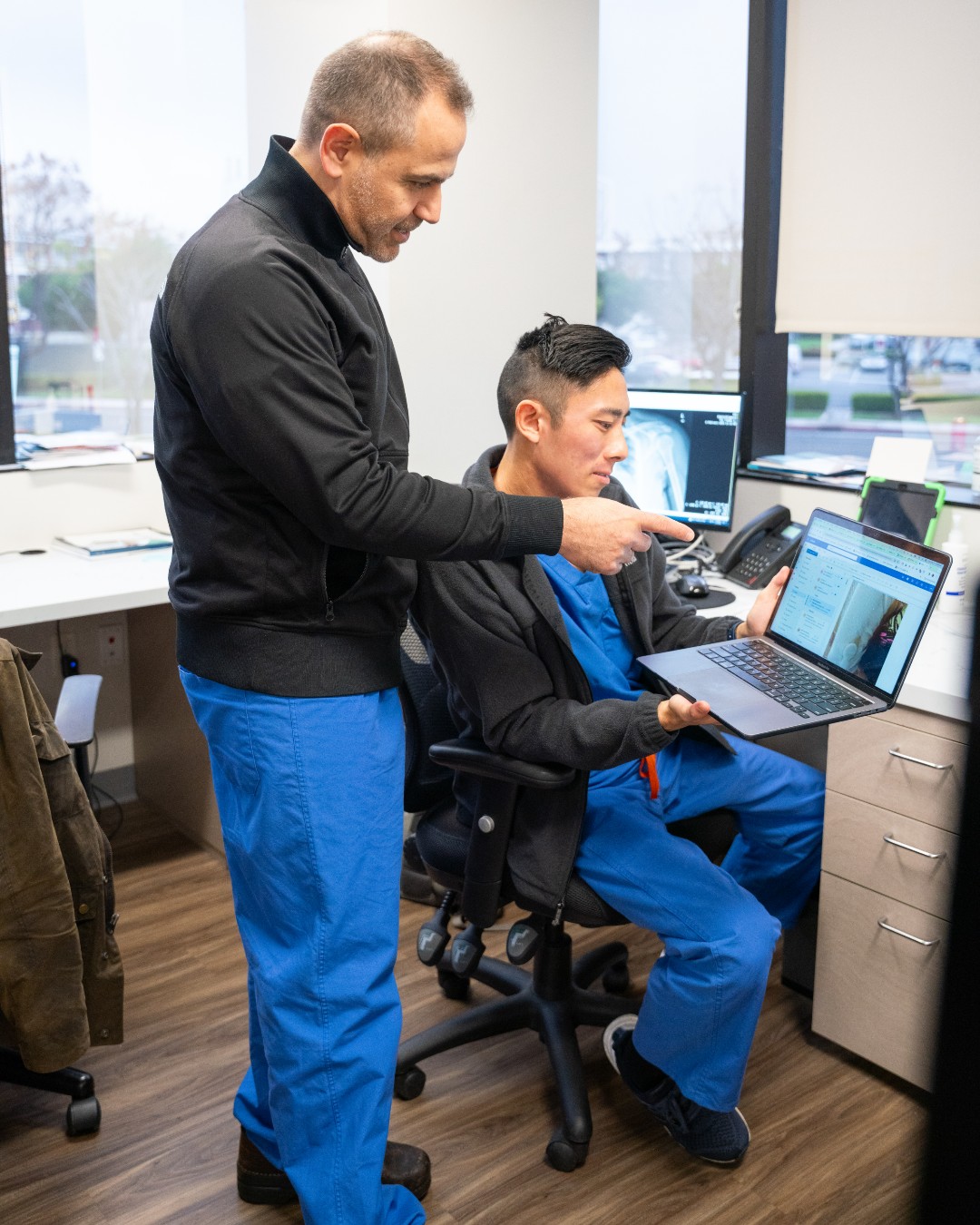 Dr. Hrayr Basmajian reviewing an X-ray of a patient's femur
